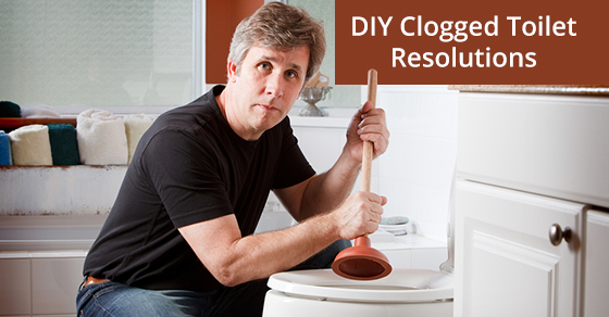 Man using a plunger to clear a clogged toilet
